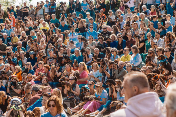 Sausage dogs and event goers at a Dachshund festival meeting in Dorpstraat, Zoetermeer, the Netherlands on 11th May 2024