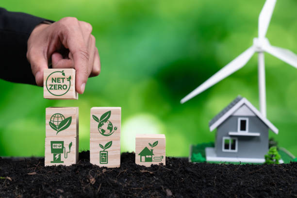 istock Businessman putting Net Zero symbol cube on stack top for green corporate. Alter 2153031014