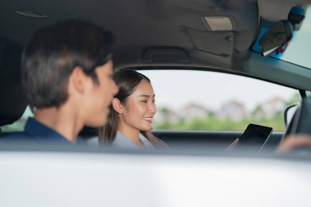 istock Smiling man in passenger seat on a road trip 2153034570
