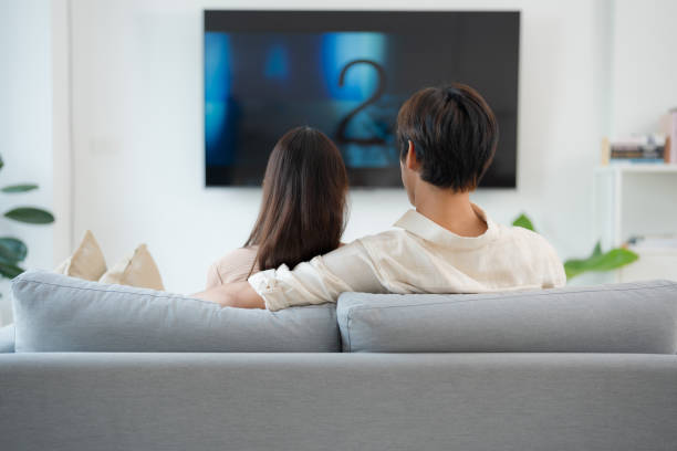 istock Cozy couple enjoying movie night at home 2153034607