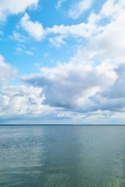 Blue sky with white clouds and sea. Nature background