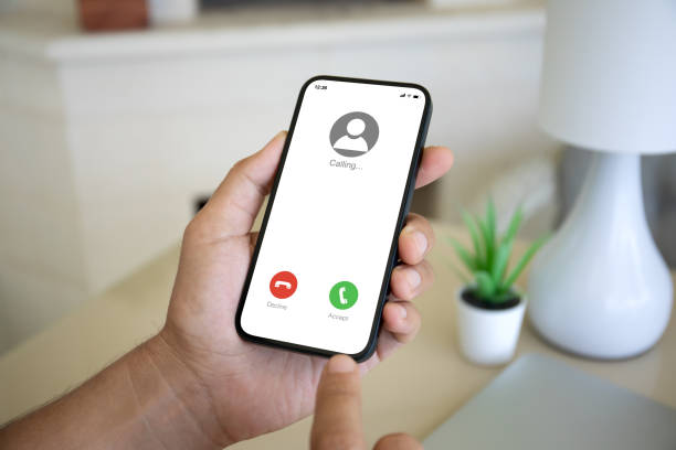 istock Man hand hold phone with incoming call on the screen 2153035071