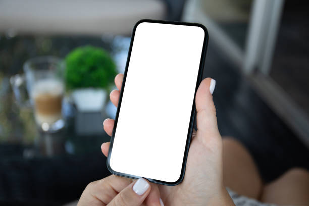 istock woman hand hold phone with isolated screen background cafe office 2153035777