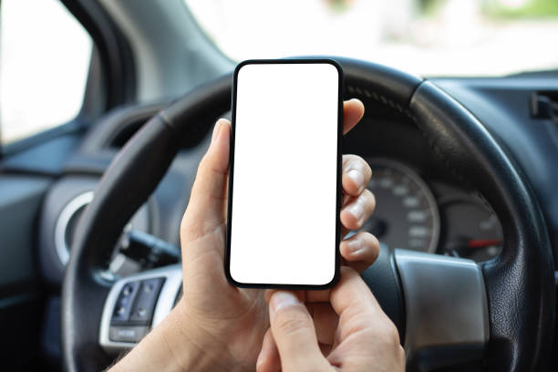 istock men hands hold phone isolated screen background steering wheel car 2153035953