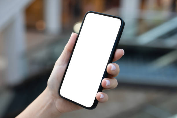 istock Female hand hold phone with isolated screen background office buildings 2153036146