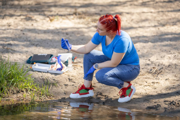 istock A young female biologist scientist takes water samples from lake 2153037174
