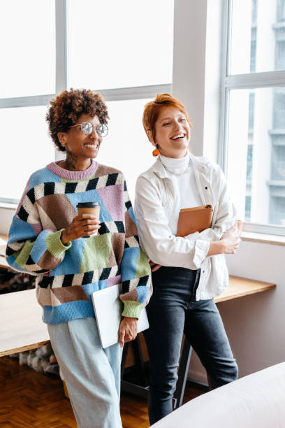 istock Freelance professionals collaborating in a modern co-working space 2153038023