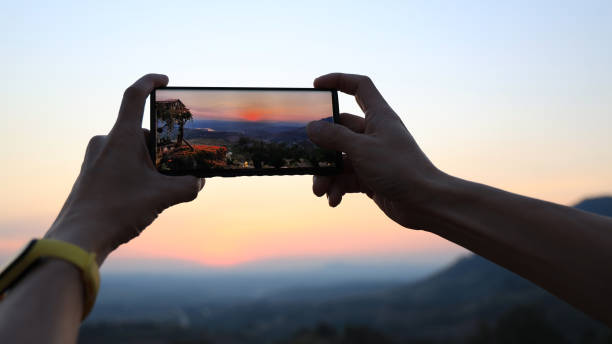 istock Man hand  taking panoramic picture view with smarthphone 2153040857