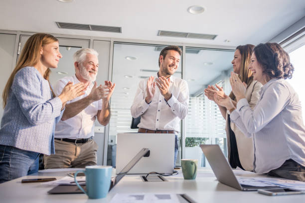 istock Young manager getting an applause after a successful meeting 2153046757