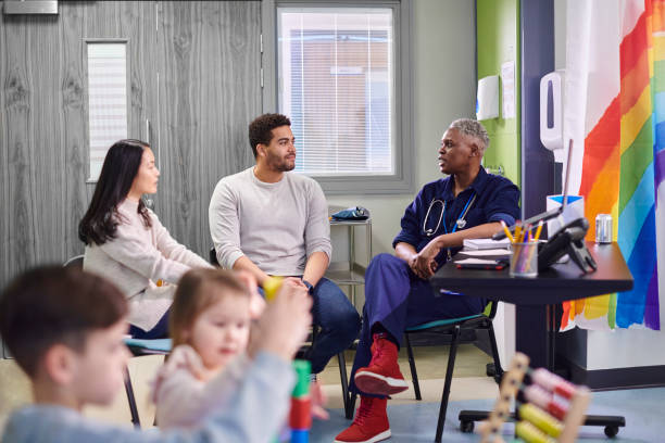 istock parents chatting to doctor on children's ward 2153049207