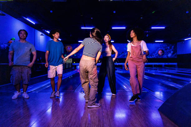 istock Friends dancing at party on a bowling alley 2153050740