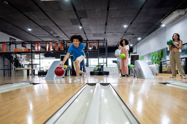 istock Young man playing bowling on a bowling alley 2153050785