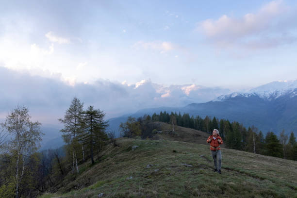 istock Mature hiker walks along rocky knoll 2153051002