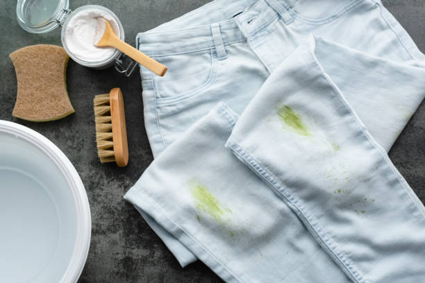 Natural cleaning products. Dirty stains of fresh green grass on blue jeans. Zero waste concept. top view hydrogen peroxide stock pictures, royalty-free photos & images