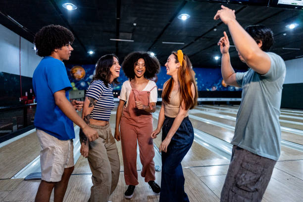 istock Friends talking and dancing on a bowling alley 2153051076