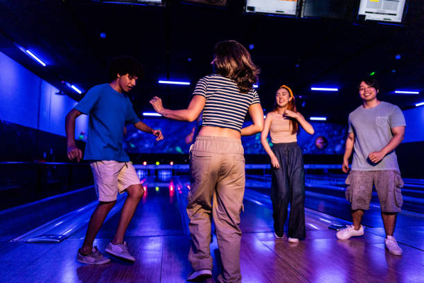 istock Friends dancing at party on a bowling alley 2153051114