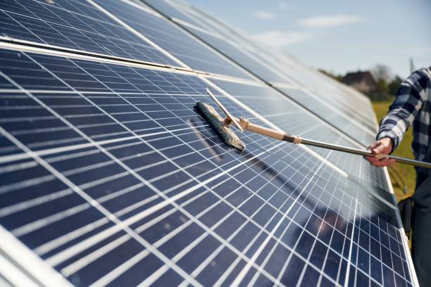istock Close up view of cleaning solar panels surface 2153051318