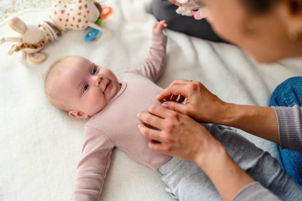 istock Cheerful mom and daughter cuddling at home 2153051399