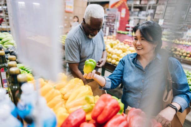 istock Senior couple customers buying at supermarket 2153051621
