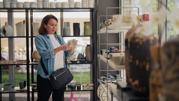istock Woman shopping at pottery shop 2153051627