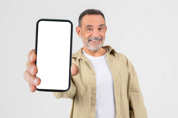 istock Man Holding Smart Phone in Hand, Copy Space 2153052269