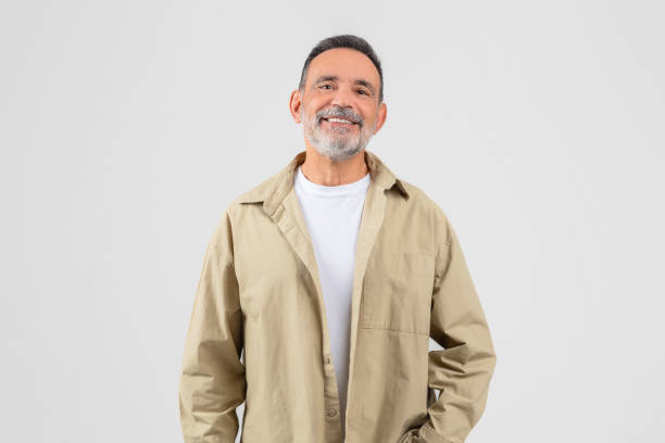 istock Cheerful senior man smiling at camera on white background 2153052424