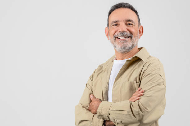 istock Happy grandfather folding arms and smiling on white background 2153052433