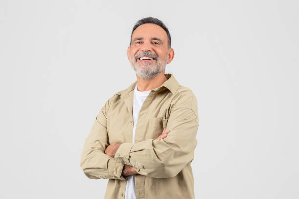 istock Grandfather laughing with arms crossed on white background 2153052435