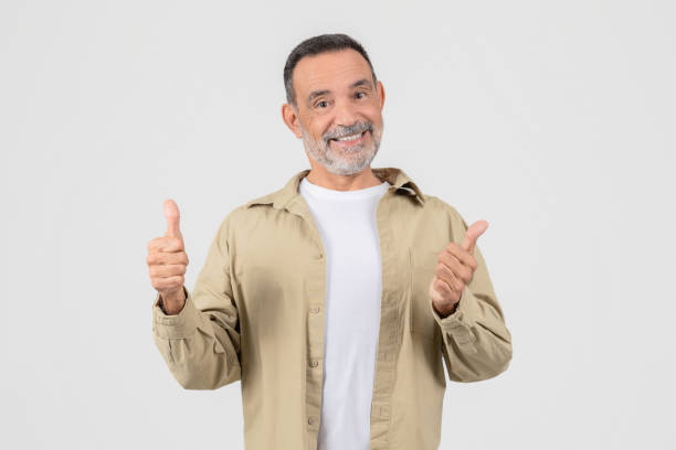 istock Elderly person giving thumbs up gesture on white background 2153052443