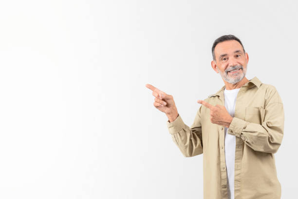 istock Senior man pointing to his side with a smile 2153052444