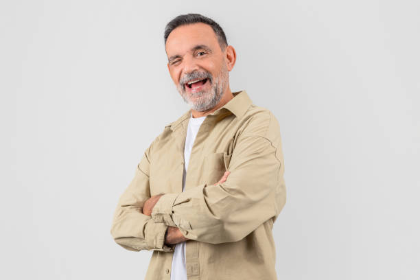 istock Friendly elderly man with arms crossed and smile 2153052463