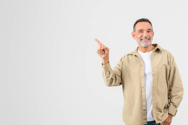 istock Senior pointing upwards confidently isolated on white 2153052477