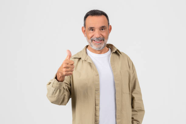 istock Senior man giving thumbs up with a smile 2153052484
