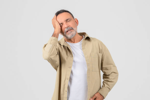 istock Senior with headache or stress reaction on white 2153052501