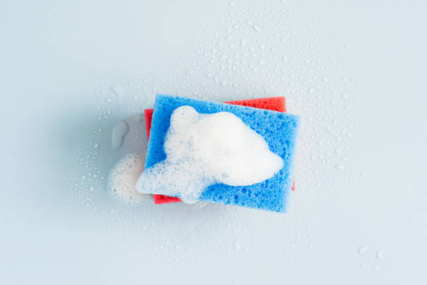 istock Cleaning sponge with foam on a blue background 2153054922