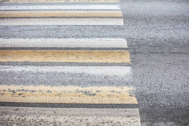 Pedestrian crossing on an asphalt road.