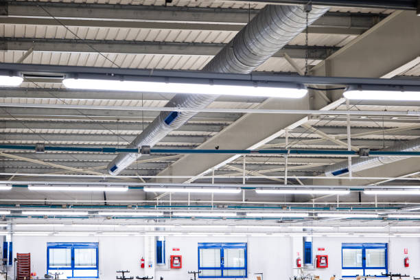istock Ceiling mounted metal ventilation pipes inside industrial space. Low angle view, no people 2153057412