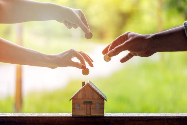 istock Real Estate Agent with house model and saving concepts 2153063110