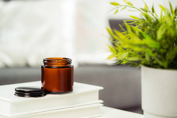 istock Aromatic candle in glass jar close up 2153064976