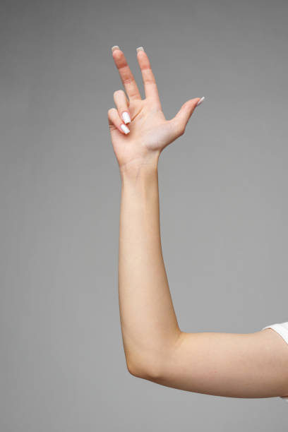 istock Female hand gesturing sign against gray background 2153065082