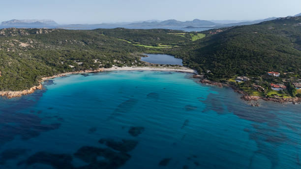 istock Sardinia is renowned for its stunning beaches, boasting crystal-clear waters, soft white sand, and dramatic rock formations. 2153067179