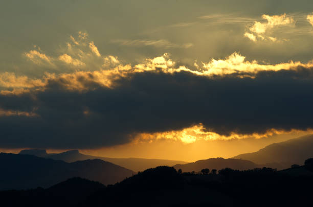 panorama of hills and clouds at sunset