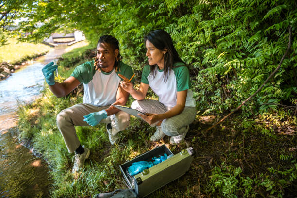 istock Environmental Scientists Conducting Water Quality Test by Stream 2153068951