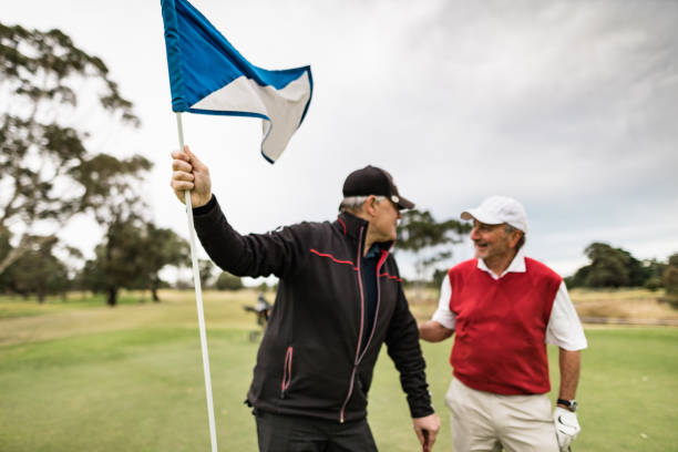 istock friends talking together at the golf course 2153069197