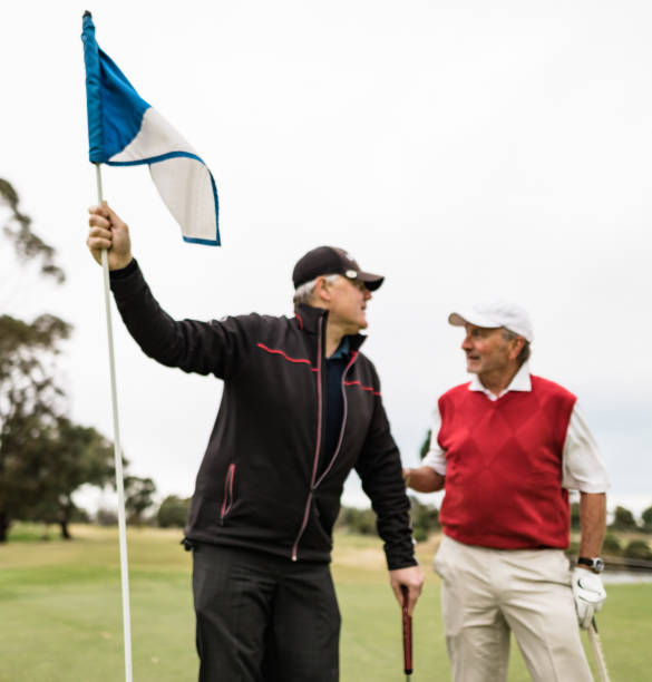 istock friends talking together at the golf course 2153069218