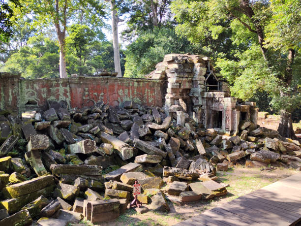 The famous ruins of Ta Prohm temple in Angkor, Cambodia, the largest religious monument in the world by land area.