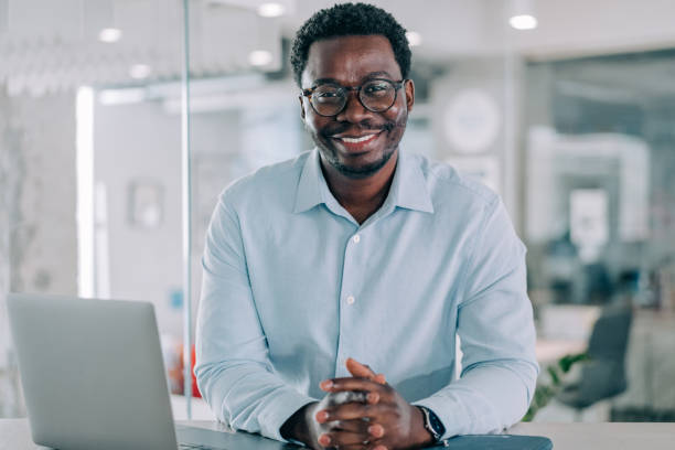 istock Successful businessman in modern office working on laptop. 2153071998
