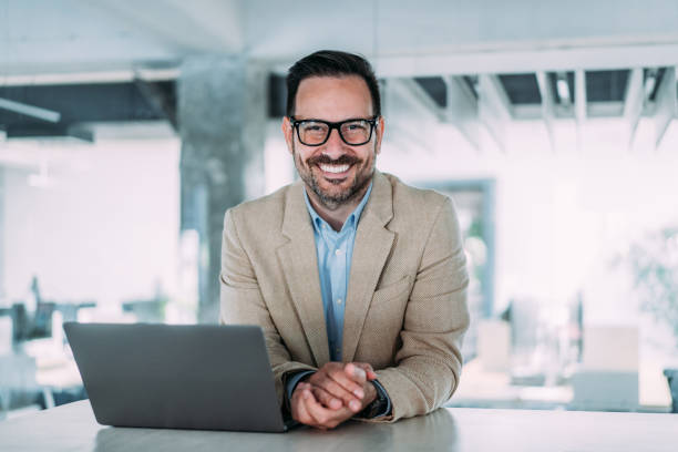 istock Successful businessman in modern office working on laptop. 2153072054