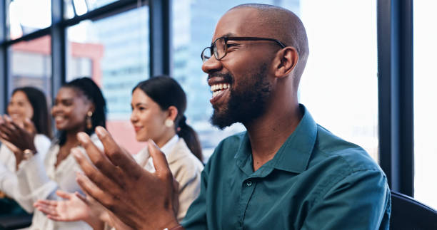 istock Businessman, team and applause in presentation for success with support, happiness and celebration in office. Conference, employees and audience clapping hands for promotion, welcome and achievement 2153079802