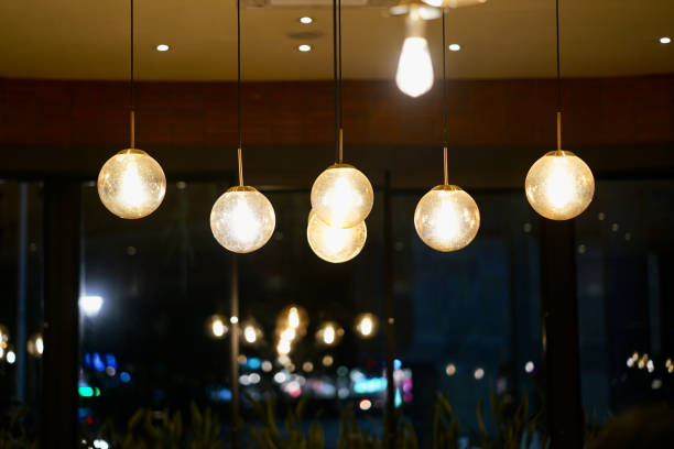 istock Hanging minimalist lamp in high-ceiling place. 2153079842